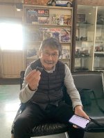 A Yosh family member holding a plug Cap.jpg